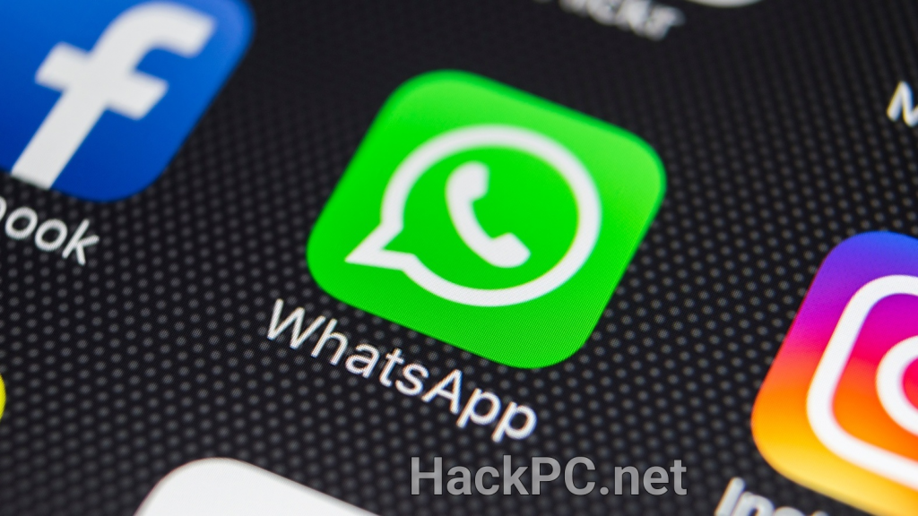 WhatsApp green logo on a smartphone screen next to Facebook and Instagram logos